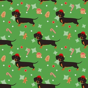 K&ouml;nnte beinhalten: Ein sich wiederholendes Muster aus schwarzen Dackel-Hunden mit roten Weihnachtsm&uuml;tzen auf gr&uuml;nem Hintergrund. Das Muster enth&auml;lt Lebkuchenm&auml;nner, Zuckerstangen, H&auml;user, Sterne und Weihnachtsbaumkekse.