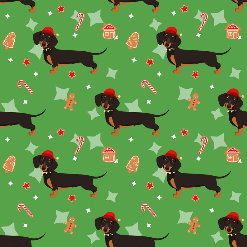 K&ouml;nnte beinhalten: Ein sich wiederholendes Muster aus schwarzen Dackel-Hunden mit roten Weihnachtsm&uuml;tzen auf gr&uuml;nem Hintergrund. Das Muster enth&auml;lt Lebkuchenm&auml;nner, Zuckerstangen, H&auml;user, Sterne und Weihnachtsbaumkekse.