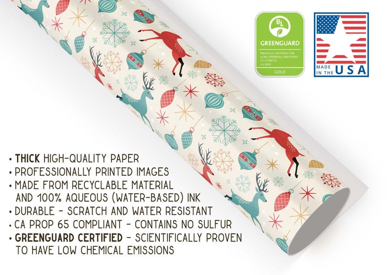 May include: A roll of Christmas-themed wrapping paper with a cream background. The paper features illustrations of red reindeer, blue reindeer, snowflakes, and ornaments. The paper is made in the USA and Greenguard certified.