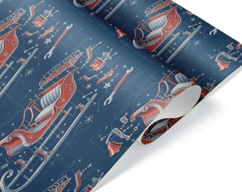 Può includere: Un rotolo di carta da regalo con sfondo blu scuro e un motivo ripetitivo a disegno tecnico. Il design include illustrazioni rosse e bianche di una slitta, campanelle, chiavi inglesi e fiocchi di neve, disposti come componenti.