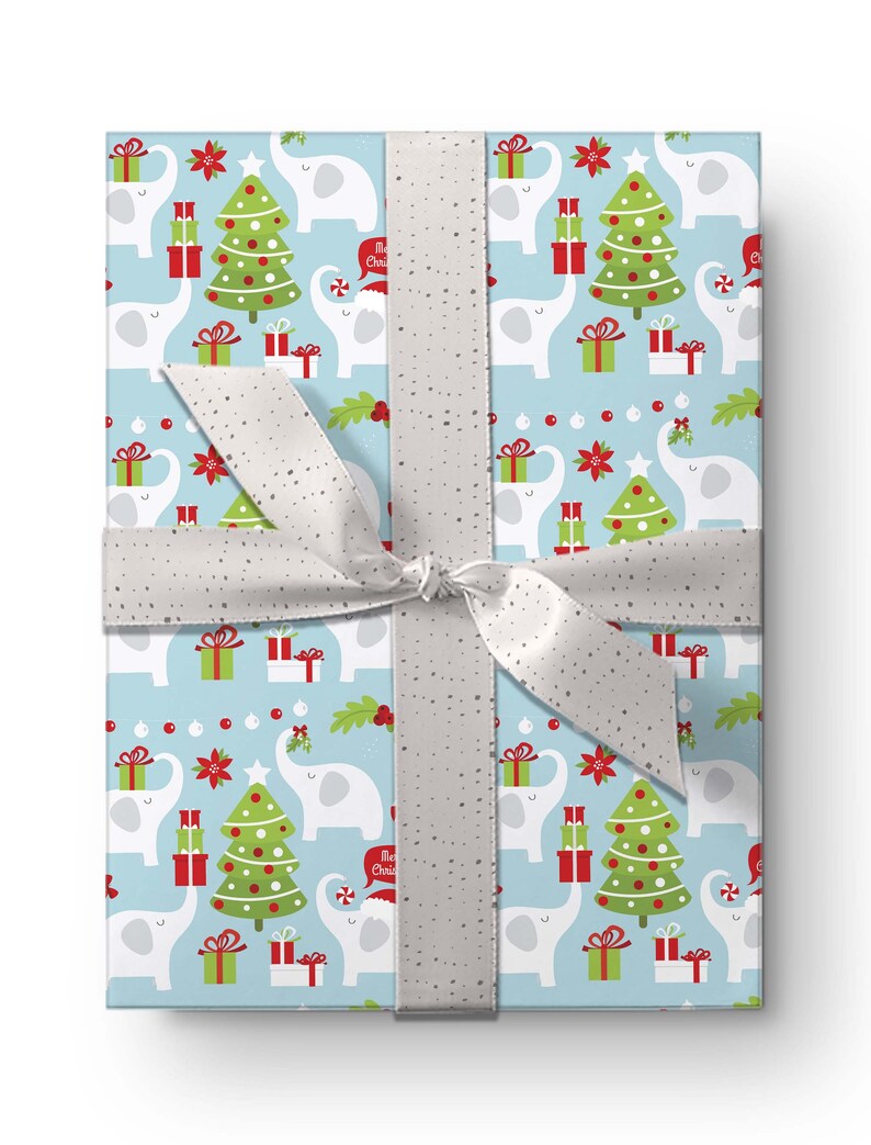 May include: A wrapped gift with light blue wrapping paper featuring a repeating pattern of white elephants, green Christmas trees, and red gift boxes. A silver ribbon with a bow secures the package.