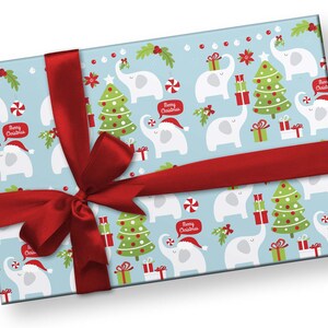 May include: A wrapped gift with light blue wrapping paper featuring a pattern of white elephants, Christmas trees, and gift boxes. The paper is tied with a wide red ribbon. The elephants are wearing Santa hats and holding gifts. Text bubbles say "Merry Christmas".