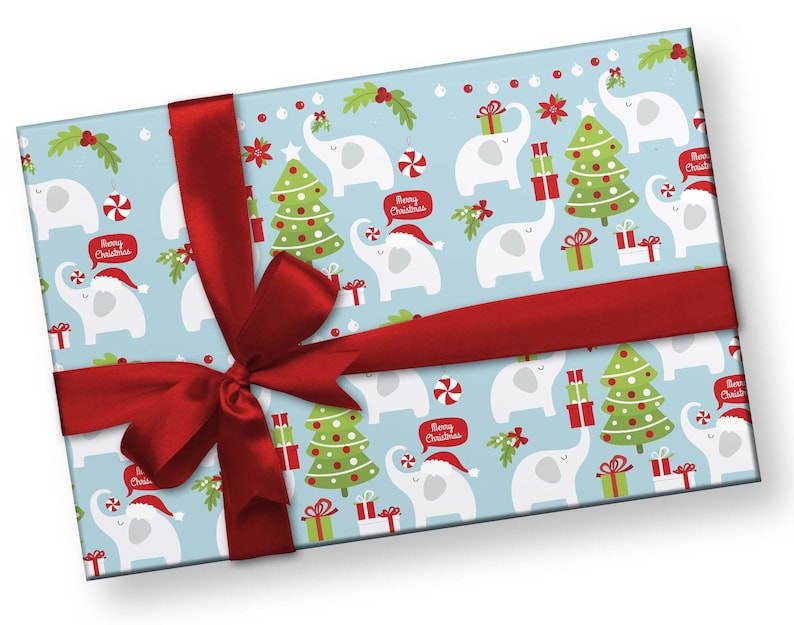 May include: A wrapped gift with light blue wrapping paper featuring a pattern of white elephants, Christmas trees, and gift boxes. The paper is tied with a wide red ribbon. The elephants are wearing Santa hats and holding gifts. Text bubbles say "Merry Christmas".