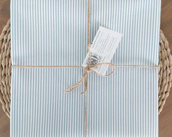 French Coated tablecloth with blue sky stripes.