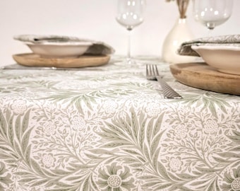Cotton tablecloth. Light green foliage on a white background.