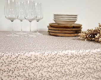 Easy-care powder pink floral coated tablecloth