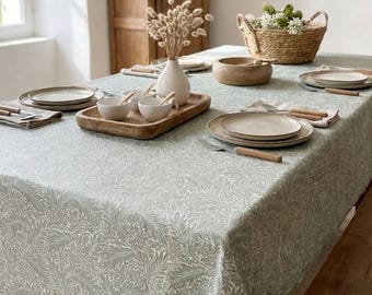 Coated tablecloth. Green foliage.