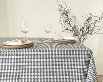 French coated tablecloth in Vosges cotton with blue fish.