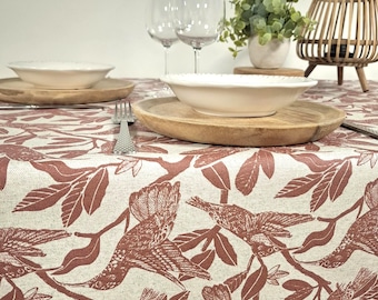 Coated tablecloth with marsala red foliage