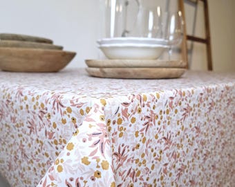 Coated tablecloth with orange and pink flowers. Easy to care for. Oeko-Tex certified.