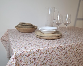 Orange and pink floral coated tablecloth