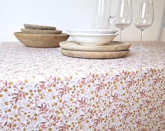 Coated tablecloth with orange and pink flowers. Easy to care for. Oeko-Tex certified.