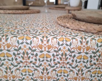 Coated cotton tablecloth from Vosges with green and yellow floral pattern