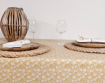 Coated tablecloth with yellow flowers. Made in France.