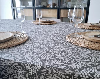Coated tablecloth with gray and white flowers and foliage