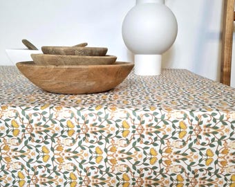 Coated cotton tablecloth from the Vosges with green and yellow floral pattern