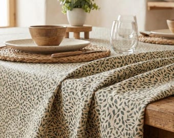 Coated tablecloth with green foliage in Vosges cotton.
