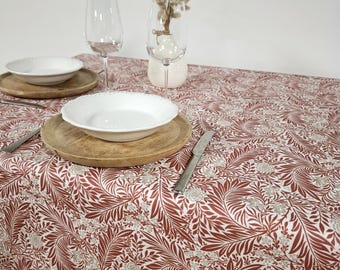 Vintage coated tablecloth with red and white floral pattern