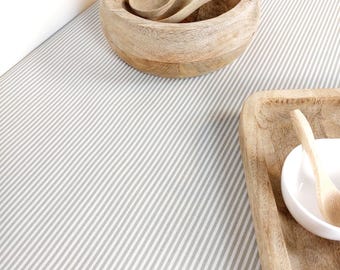 Coated tablecloth in Vosges cotton with white and beige stripes.