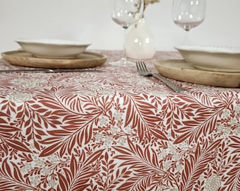 Vintage coated tablecloth with red and white floral pattern