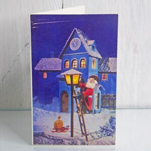 Cartão de Ano Novo, Cartão postal não utilizado, Papai Noel acendendo uma lanterna de Natal, Cartão comemorativo, Cartão raro, Cartão de Natal, 1979