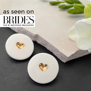 White porcelain studs earrings, with a heart in the middle, hand-painted with pure gold. A perfect wedding porcelain anniversary gift. Featured in BRIDES magazine. Ready for a gift-giving.