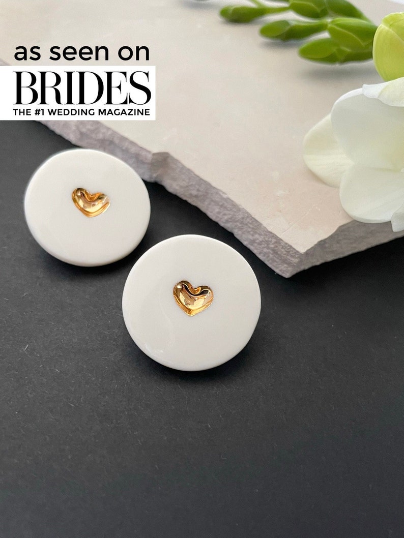 White porcelain studs earrings, with a heart in the middle, hand-painted with pure gold. A perfect wedding porcelain anniversary gift. Featured in BRIDES magazine. Ready for a gift-giving.