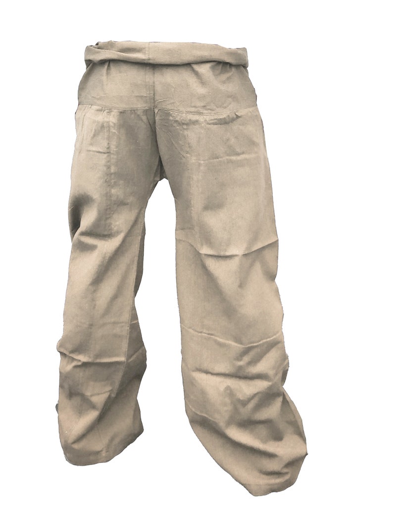 May include: A pair of beige cotton pants with a wide leg and a gathered waistband.