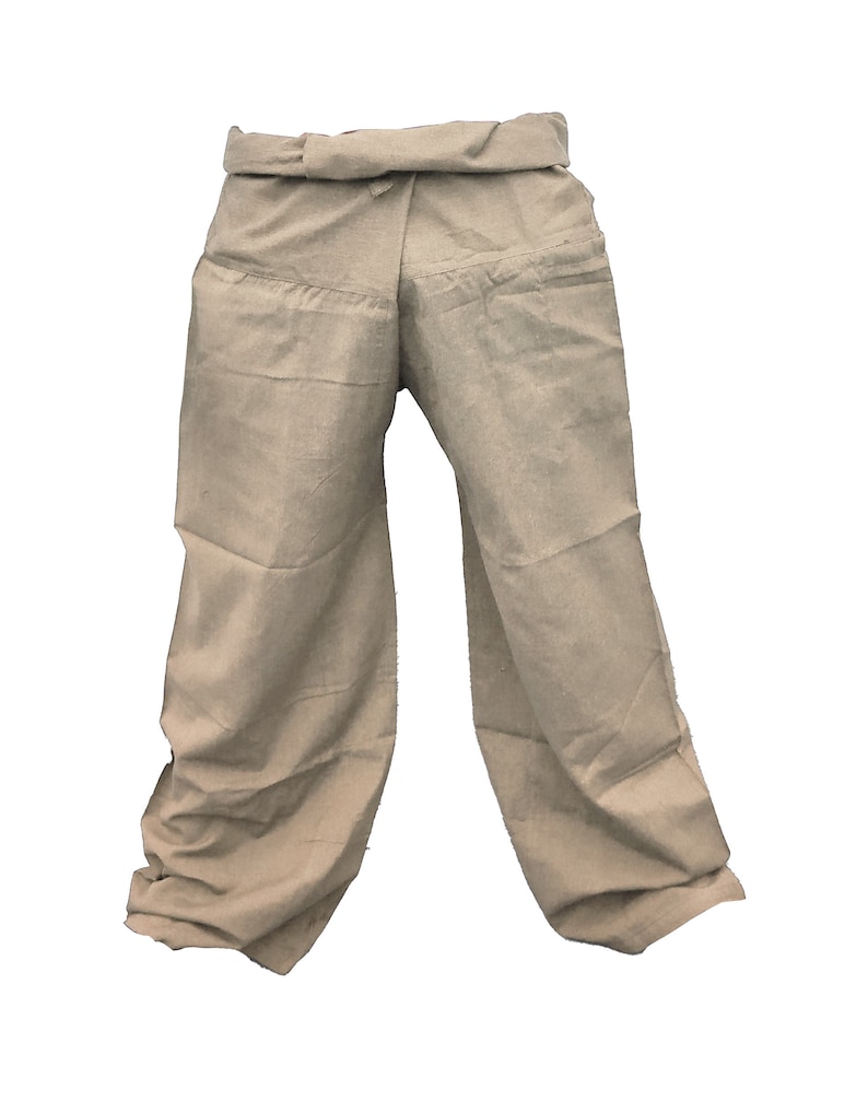 May include: A pair of beige linen pants with a wide waistband and a loose fit.