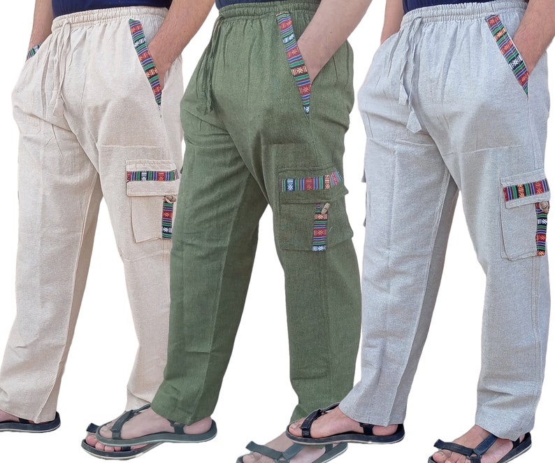 May include: Three pairs of casual pants with a drawstring waist and side pockets. The pants are made of a lightweight fabric and have a colorful patterned trim. The pants are available in beige, green, and gray.