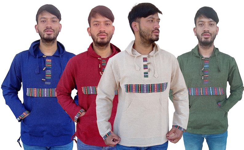 May include: Four hooded shirts in different colors: blue, red, beige, and green. Each shirt has a decorative band of colorful stripes across the chest and a row of wooden buttons down the front.