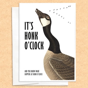 May include: A greeting card with a cartoon illustration of a goose with its head tilted back, honking. The text reads "It's Honk O'Clock" and "And you know what happens at Honk O'Clock".