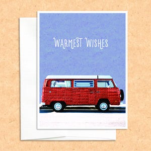 May include: A red vintage van with a white roof and windows against a blue background. The text "Warmest Wishes" is written in white above the van.
