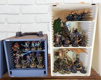 May include: Two open storage cases with multiple shelves, each filled with miniature figures painted in various colours. The figures are arranged on circular bases and include dragons, knights, and other fantasy creatures.