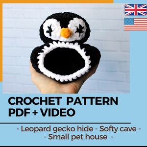 May include: A handmade black and white crochet pet house shaped like a penguin. The penguin has white eyes, a white belly, and an orange beak. The text "CROCHET PATTERN PDF + VIDEO" is visible. It is designed as a leopard gecko hide or small pet house.