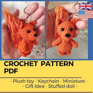 May include: Crochet pattern PDF for a miniature orange fox plush toy keychain. The pattern includes instructions for making a stuffed animal keychain.