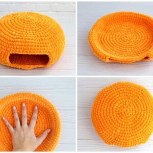 May include: Four orange crocheted cat beds in different shapes. The beds are made of a soft, fuzzy yarn and have a round, oval, and square shape.