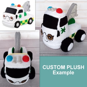 May include: A white crocheted plush toy tow truck with black wheels, a green and yellow stripe, and a red and blue light on top. The truck has a friendly face with black eyes and glasses, a black mouth, and a green cross on the side. The text "CUSTOM PLUSH Example" is written in white on a teal background.