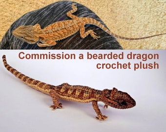 May include: A crocheted plush bearded dragon toy. The toy is brown and tan with a striped pattern. The toy is posed on a white surface. Commission a bearded dragon crochet plush.