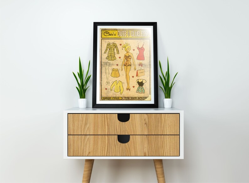 May include: A vintage-style paper doll set with a blonde doll and various outfits. The paper doll set is titled "Cher's Cute &  Clueless" and features a yellow, red, and black color scheme.