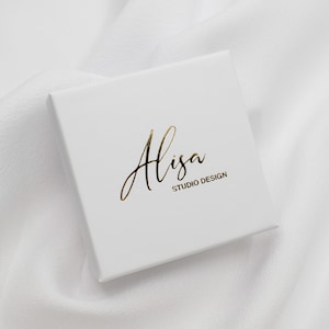 May include: White box with gold lettering that reads "Alisa Studio Design".
