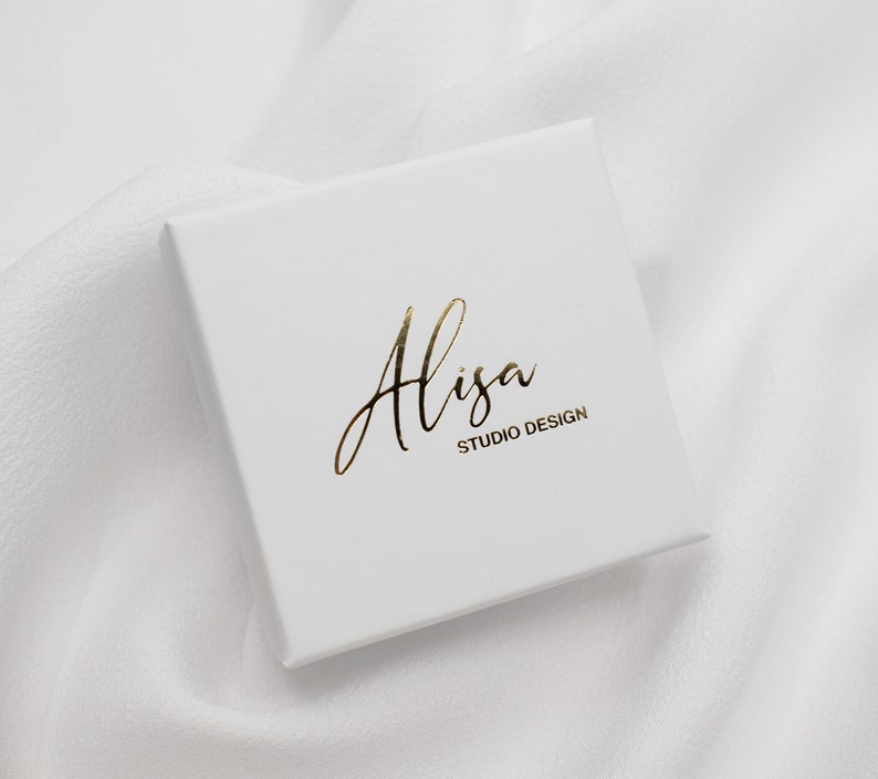May include: White box with gold lettering that reads "Alisa Studio Design".