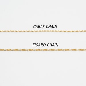 May include: Two gold chains, one labeled "Cable Chain" and the other labeled "Figaro Chain".