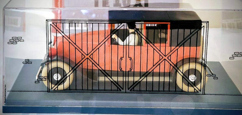 May include: A set of three ceramic mugs with a speckled, cream-colored glaze. Each mug features a different hand-painted design: a blue and green leaf, a yellow flower, and a red berry. The mugs have a simple, rounded shape.