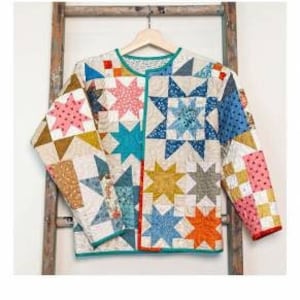 May include: A quilted jacket pattern called "Beachcomber" with a colorful patchwork design featuring stars and geometric shapes. The jacket is made with a variety of fabrics in shades of blue, yellow, orange, pink, and white.