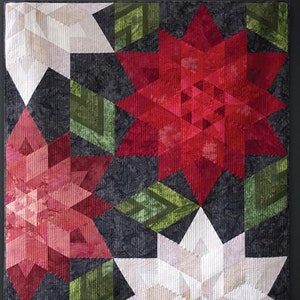 May include: A quilted wall hanging with a poinsettia design in red, white, and green. The text "CRIMSON christmas" is at the top. The size is 52.5" x 56.5". The artist is Krista Moser.