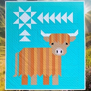 May include: A quilt pattern featuring a Highland cow design. The quilt has a turquoise background with white geometric shapes and a brown and orange cow. The text "Cattle Call" and "A Highland Coo Quilt" are displayed. The quilt measures 40" x 45".