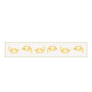 May include: A white ribbon with a repeating pattern of gold geometric shapes.
