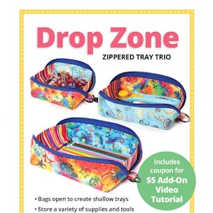 May include: The image showcases a "Drop Zone" zippered tray trio. The bags feature colorful, patterned fabric with blue trim and zippers. The text on the image says "Bags open to create shallow trays" and "Great visibility and easy access!"