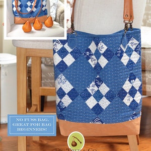 May include: A blue and white denim patchwork tote bag with brown leather straps and a brown leather bottom. The bag is sitting on a wooden chair. The text "NO FUSS BAG. GREAT FOR BAG BEGINNERS!" is on a blue sign in the lower left corner of the image. The text "FIG TREE & CO. by Joanna Figueroa" is on a green leaf with a brown fig in the lower right corner of the image.